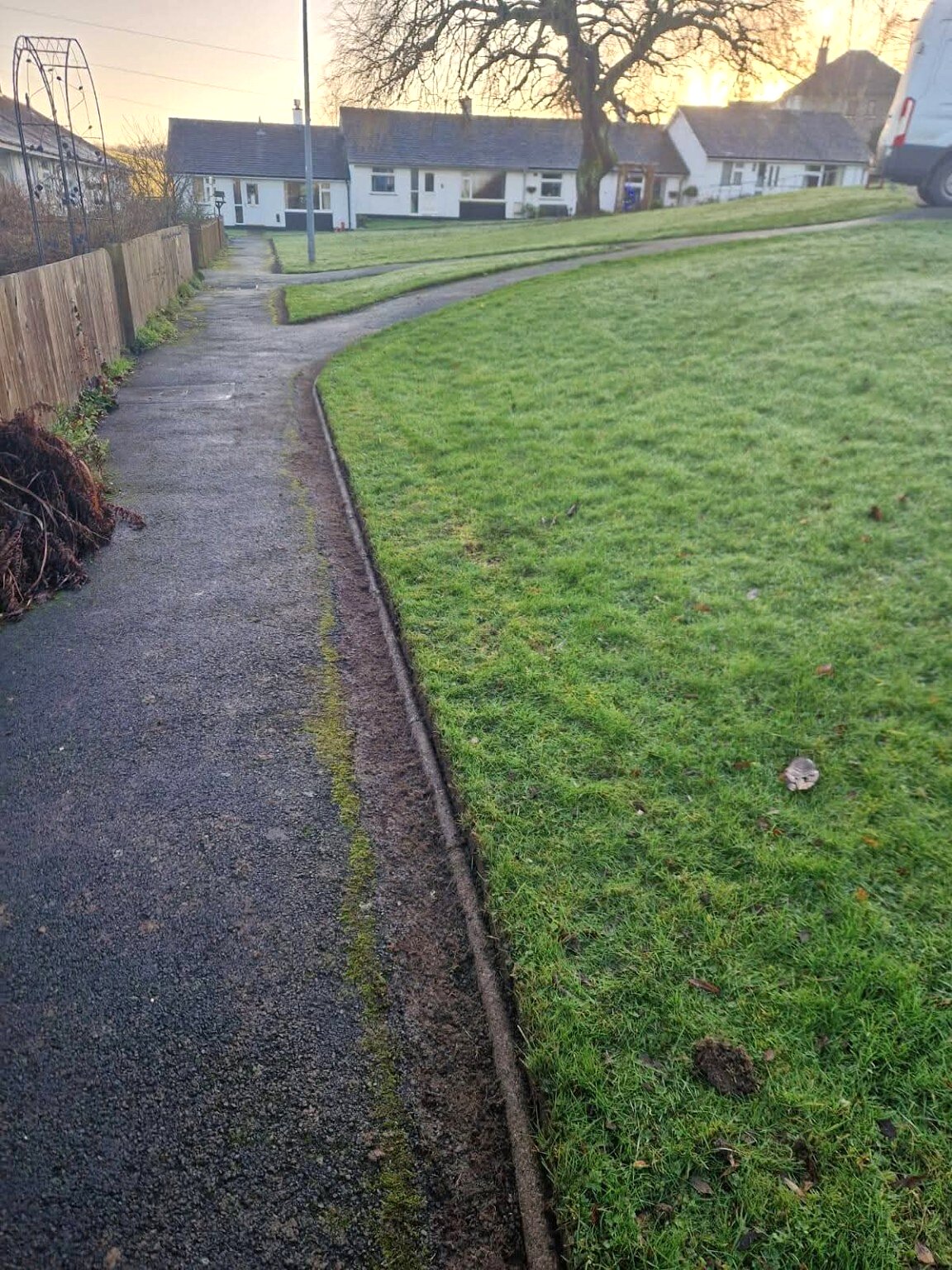 Defined lawn edges along a commercial footpath